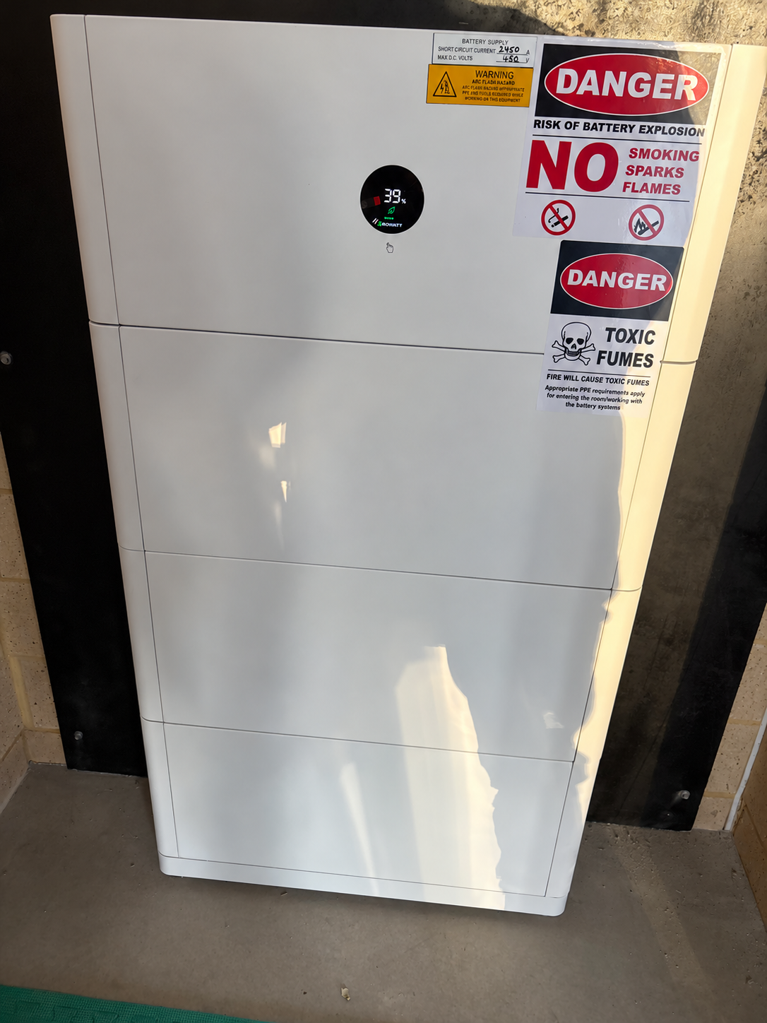 Close view of the Growatt battery installed at the family home